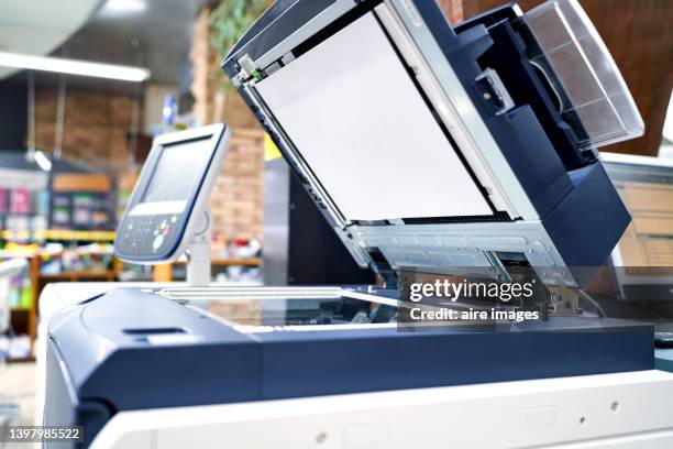 view of a modern photocopier printer machine in a workplace office. business, office supplies and technology concept. - kopiergerät stock-fotos und bilder