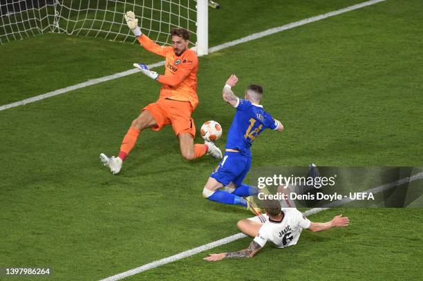 Ryan Kent of Rangers has a shot blocked by Kevin Trapp of Eintracht Frankfurt whilst under pressure from Kristijan Jakic of Eintracht Frankfurt...