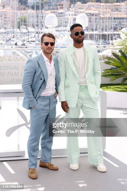 Glen Powell and Jay Ellis attend a cast photo call for "Top Gun: Maverick" during the 75th annual Cannes film festival at Palais des Festivals on May...
