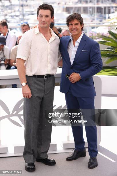 Miles Teller and Tom Cruise attend a cast photo call for "Top Gun: Maverick" during the 75th annual Cannes film festival at Palais des Festivals on...