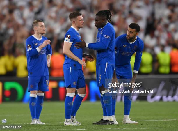 Aaron Ramsey of Rangers looks dejected as they are consoled by Calvin Bassey following defeat in the UEFA Europa League final match between Eintracht...