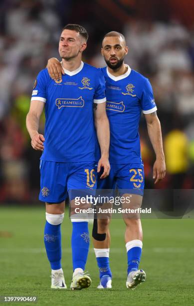 Aaron Ramsey of Rangers looks dejected as they are consoled by Kemar Roofe following defeat in the UEFA Europa League final match between Eintracht...