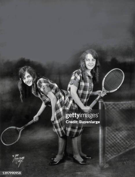 Daisy and Violet Hilton, conjoined twins, ready for tennis. Daisy and Violet Hilton , "The Siamese Twins of Texas", were born in Brighton, West...