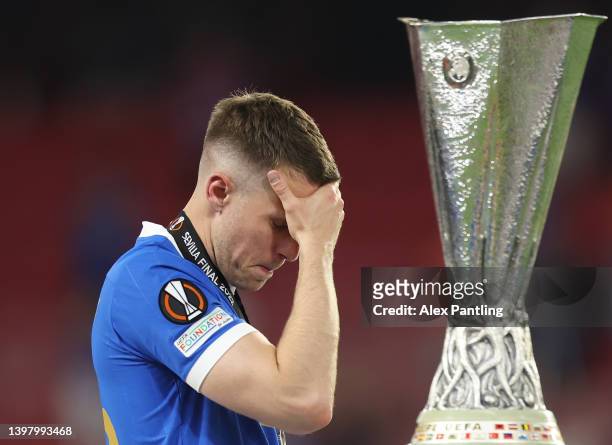 Aaron Ramsey of Rangers looks dejected as they walk past the UEFA Europa League trophy following their sides defeat in the UEFA Europa League final...
