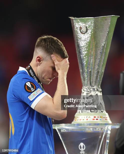 Aaron Ramsey of Rangers looks dejected as they walk past the UEFA Europa League trophy following their sides defeat in the UEFA Europa League final...