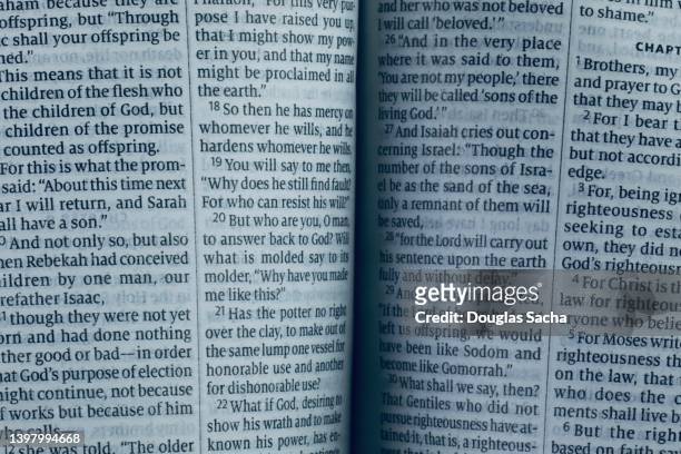 close-up of an opened holy bible book in english text - free bible image stock-fotos und bilder