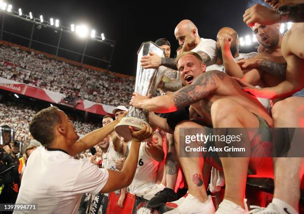 Timmy Chandler of Eintracht Frankfurt and Eintracht Frankfurt fans celebrate with the UEFA Europa League Trophy following their sides victory in the...
