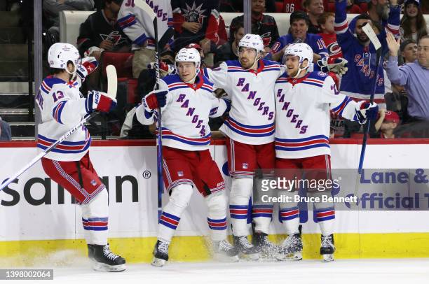 Filip Chytil of the New York Rangers celebrates his goal against the Carolina Hurricanes at 7:07 of the first period and is joined by Alexis...