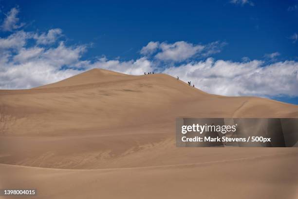 summer fun in great sand dunes national park - great sand dunes national park stock pictures, royalty-free photos & images