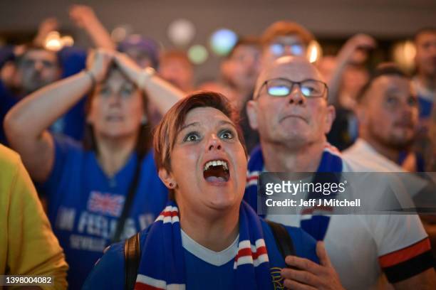 Rangers fans react as they see their side lose on penalties as they watch the match in The Auctioneers pub during the UEFA Europa League Final on May...