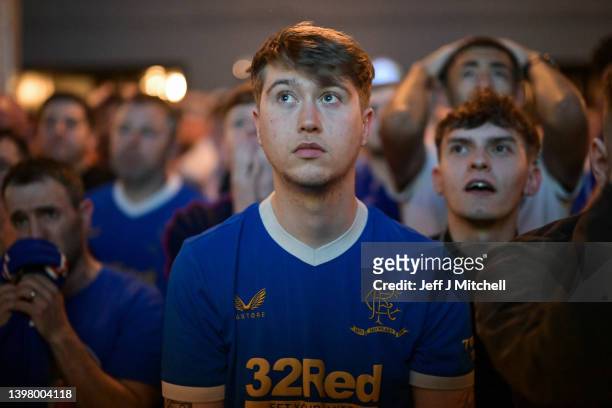 Fan of Rangers reacts during his side's lose on penalties as they watch the match in The Auctioneers pub during the UEFA Europa League Final on May...