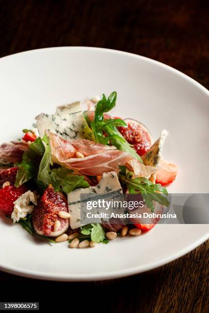 prosciutto di parma salad with figs and blue cheese - parma italy stock pictures, royalty-free photos & images