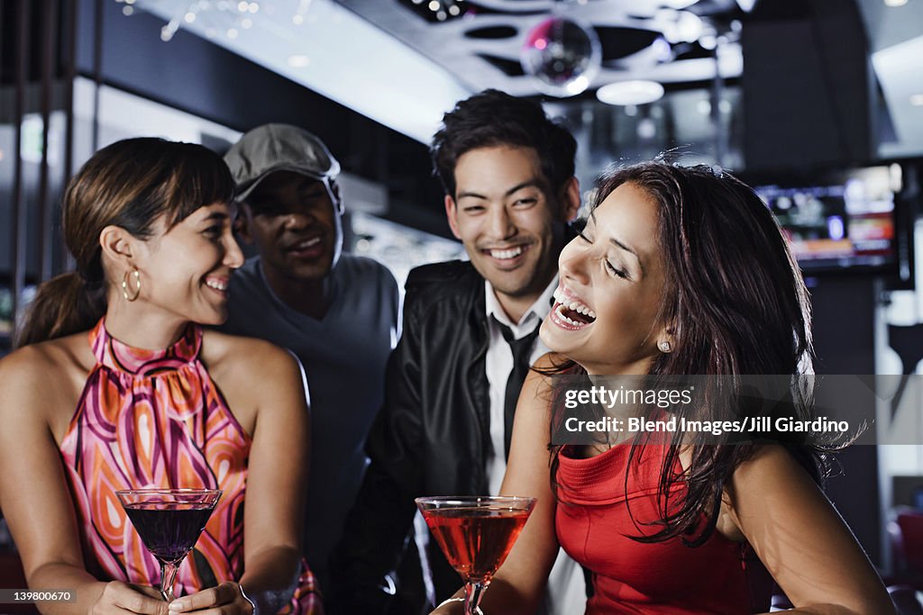 Friends drinking in nightclub