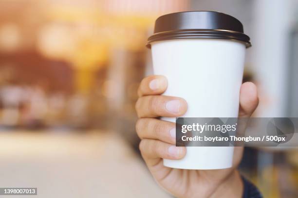 young woman hand holding paper cup - mug mockup stock pictures, royalty-free photos & images