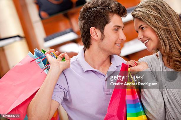 hispanic couple shopping together - cundinamarca stock pictures, royalty-free photos & images