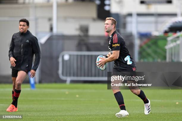 Braydon Ennor takes part in a drill during a Crusaders Super Rugby Pacific training session at Orangetheory Stadium on May 19, 2022 in Christchurch,...