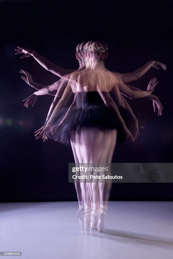 Caucasian ballerina dancing on stage