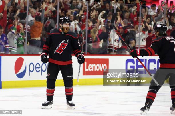 Ian Cole of the Carolina Hurricanes scores at 3:12 of overtime against the New York Rangers in Game One of the Second Round of the 2022 Stanley Cup...
