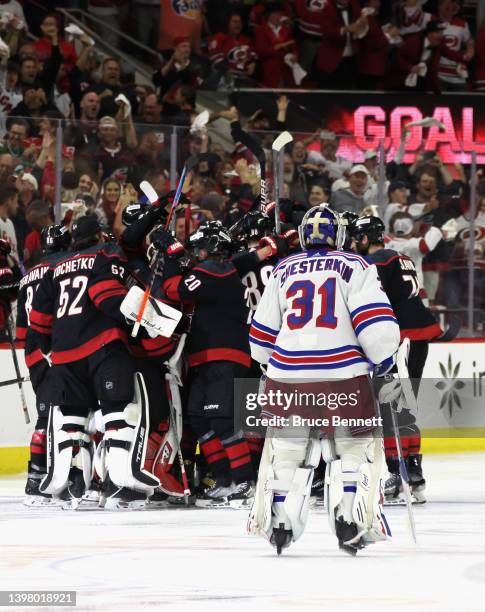 Ian Cole of the Carolina Hurricanes scores at 3:12 of overtime against Igor Shesterkin of the New York Rangers in Game One of the Second Round of the...