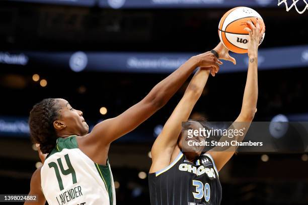 Jantel Lavender of the Seattle Storm fouls Azura Stevens of the Chicago Sky during the first half at Climate Pledge Arena on May 18, 2022 in Seattle,...
