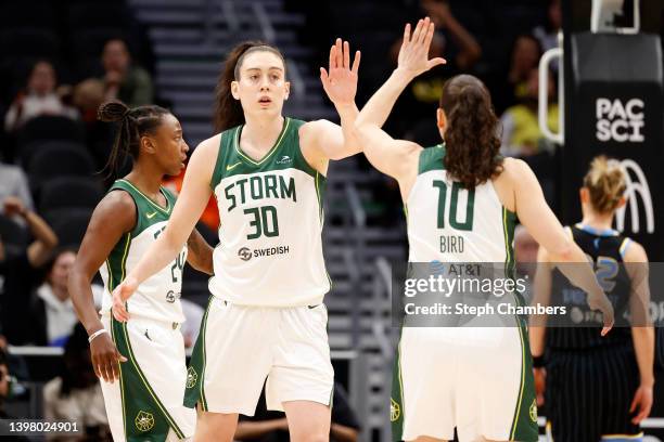 Breanna Stewart and Sue Bird of the Seattle Storm react after a basket against the Chicago Sky during the first half at Climate Pledge Arena on May...