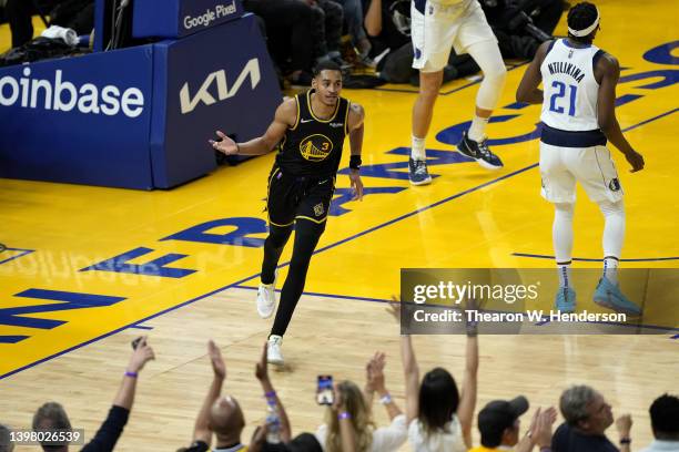 Jordan Poole of the Golden State Warriors celebrates a basket against the Dallas Mavericks during the fourth quarter in Game One of the 2022 NBA...