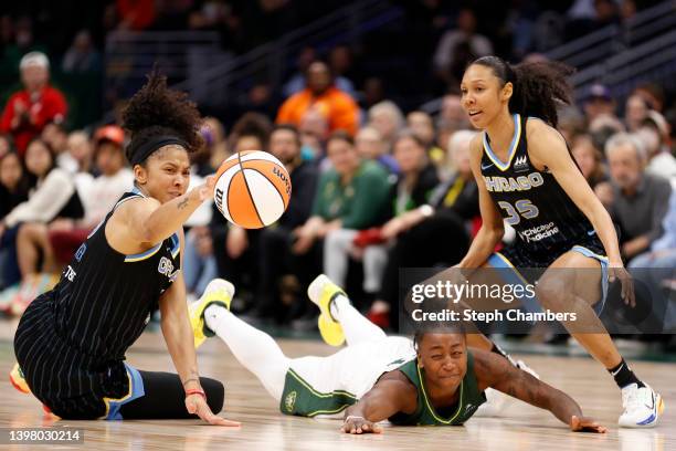 Candace Parker of the Chicago Sky reaches for a loose ball against Jewell Loyd of the Seattle Storm at Climate Pledge Arena on May 18, 2022 in...