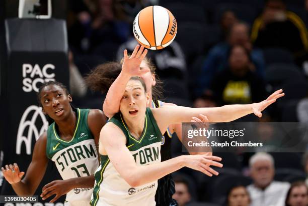 Emma Meesseman of the Chicago Sky reaches for a rebound over Breanna Stewart of the Seattle Storm during the second half at Climate Pledge Arena on...