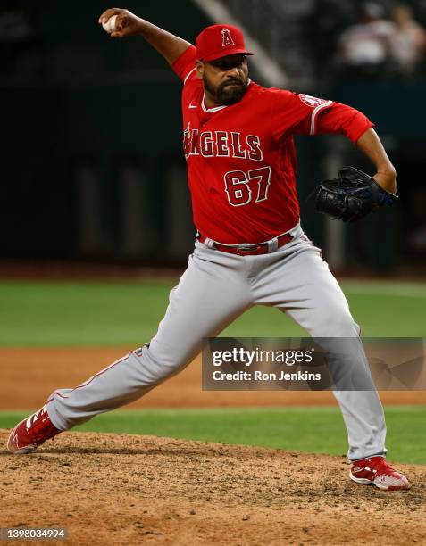 Cesar Valdez of the Los Angeles Angels pitches against the Texas Rangers at Globe Life Field on May 17, 2022 in Arlington, Texas. The Rangers won...