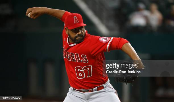 Cesar Valdez of the Los Angeles Angels pitches against the Texas Rangers at Globe Life Field on May 17, 2022 in Arlington, Texas. The Rangers won...