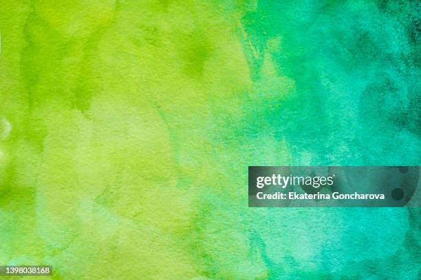 abstract green and yellow watercolor background - body color stock-fotos und bilder