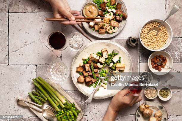 vegan foods prepared on table and ready to be shared - tofoe stockfoto's en -beelden