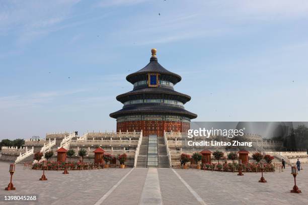 Workers cleans the grounds at the Temple of Heaven park on May 19, 2022 in Beijing, China. China is trying to contain a spike in coronavirus cases in...