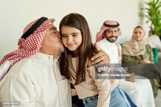 multi-generation saudi family celebrating eid-ul-fitr - saudi grandfather stock pictures, royalty-free photos & images
