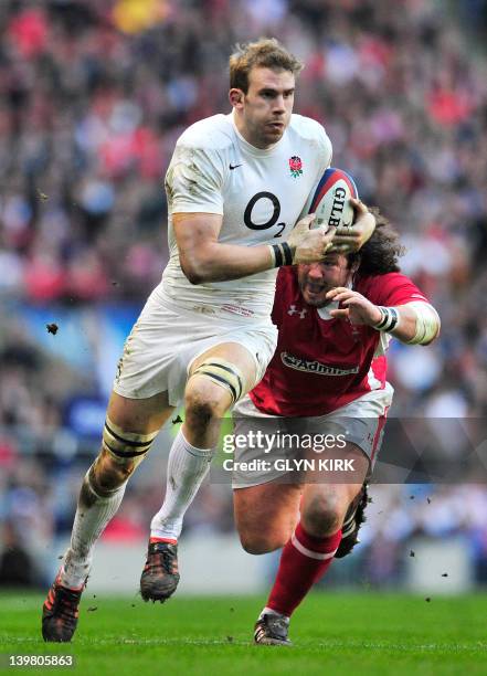 England's flanker Tom Croft runs past Wales' prop Adam Jones during the 6 Nations International rugby union match between England and Wales at...