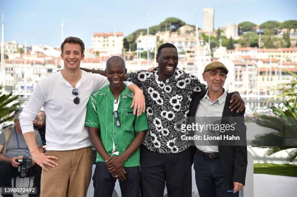 Jonas Bloquet, Alassane Diong, Omar Sy and Mathieu Vadepied attend the photocall for "Tirailleurs" during the 75th annual Cannes film festival at...