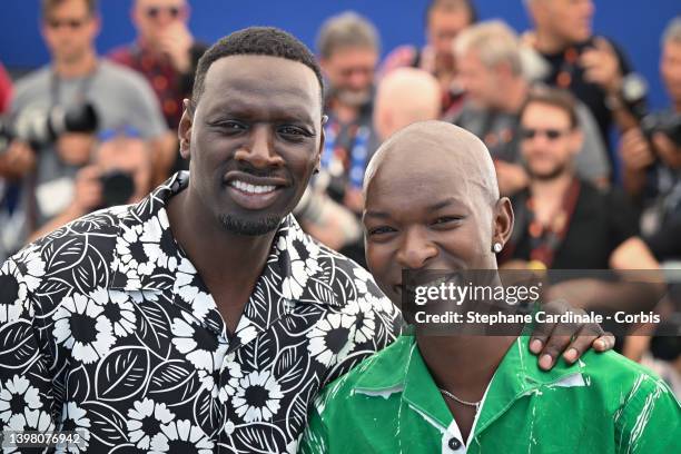 Omar Sy and Alassane Diong attend the photocall for "Tirailleurs" during the 75th annual Cannes film festival at Palais des Festivals on May 19, 2022...