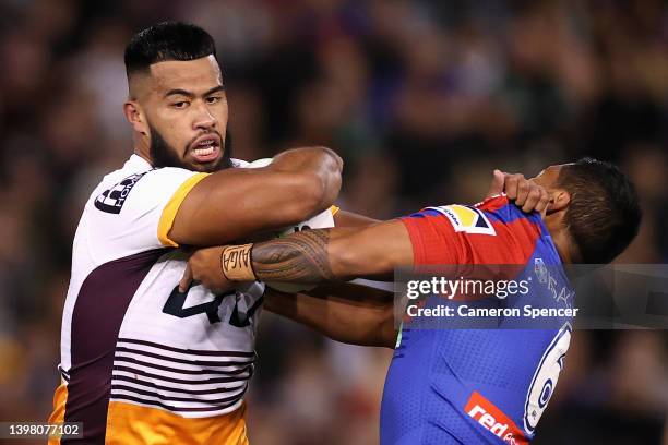 Payne Haas of the Broncos is tackled during the round 11 NRL match between the Newcastle Knights and the Brisbane Broncos at McDonald Jones Stadium,...