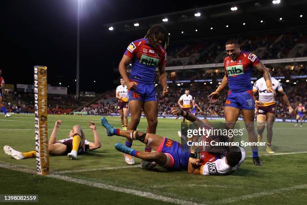 Dane Gagai of the Knights scores a try that was then disallowed during the round 11 NRL match between the Newcastle Knights and the Brisbane Broncos...