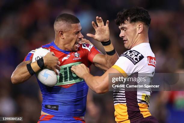 Dane Gagai of the Knights is tackled during the round 11 NRL match between the Newcastle Knights and the Brisbane Broncos at McDonald Jones Stadium,...