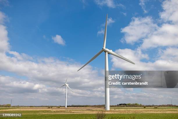 wind turbine in a flat landscape - spring denmark stock pictures, royalty-free photos & images