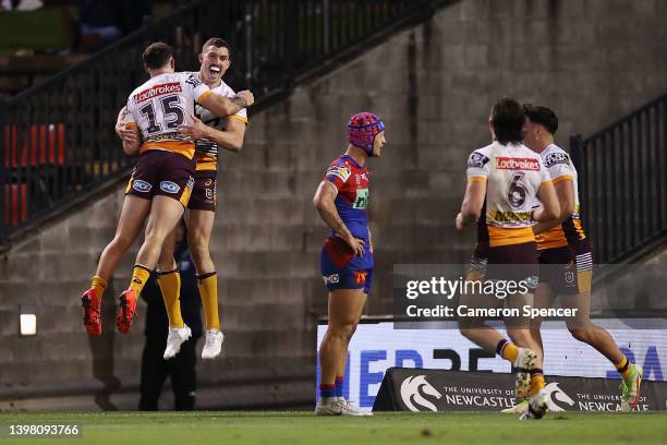 Corey Oates of the Broncos celebrates scoring a try during the round 11 NRL match between the Newcastle Knights and the Brisbane Broncos at McDonald...