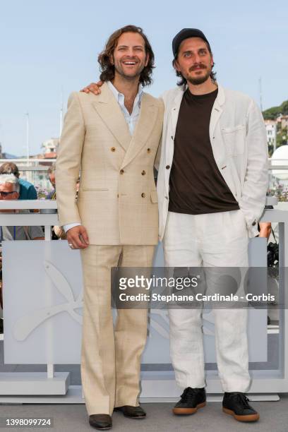 Alessandro Borghi and Luca Marinelli attend the photocall for "The Eight Mountains " during the 75th annual Cannes film festival at Palais des...