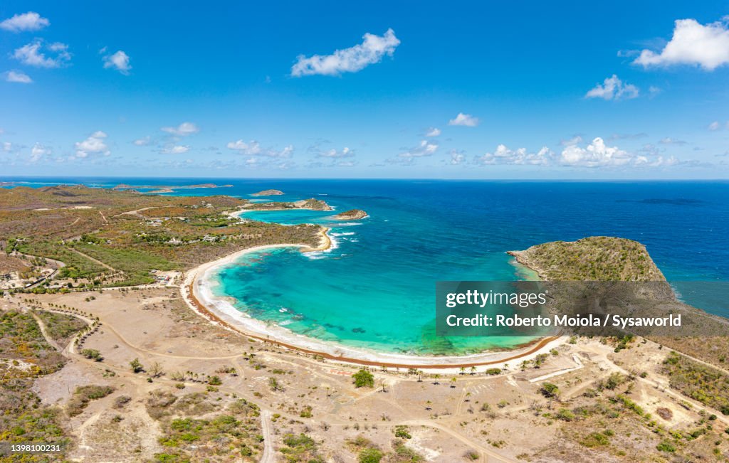 Empty sand beach washed by Caribbean Sea, aerial view