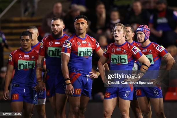 Knights players look dejected during the round 11 NRL match between the Newcastle Knights and the Brisbane Broncos at McDonald Jones Stadium, on May...