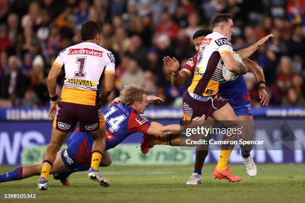 Kobe Hetherington of the Broncos makes a break during the round 11 NRL match between the Newcastle Knights and the Brisbane Broncos at McDonald Jones...