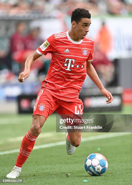 Jamal Musiala of Bayern Munich in action during the Bundesliga match between VfL Wolfsburg and FC Bayern München at Volkswagen Arena on May 14, 2022...