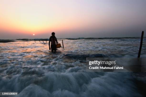 fisherman returning from sea - indian arrival stock pictures, royalty-free photos & images