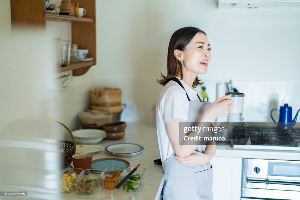 A woman relaxing in the kitchen
