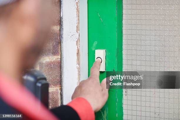 close-up of hand pressing door bell - door bell 個照片及圖片檔